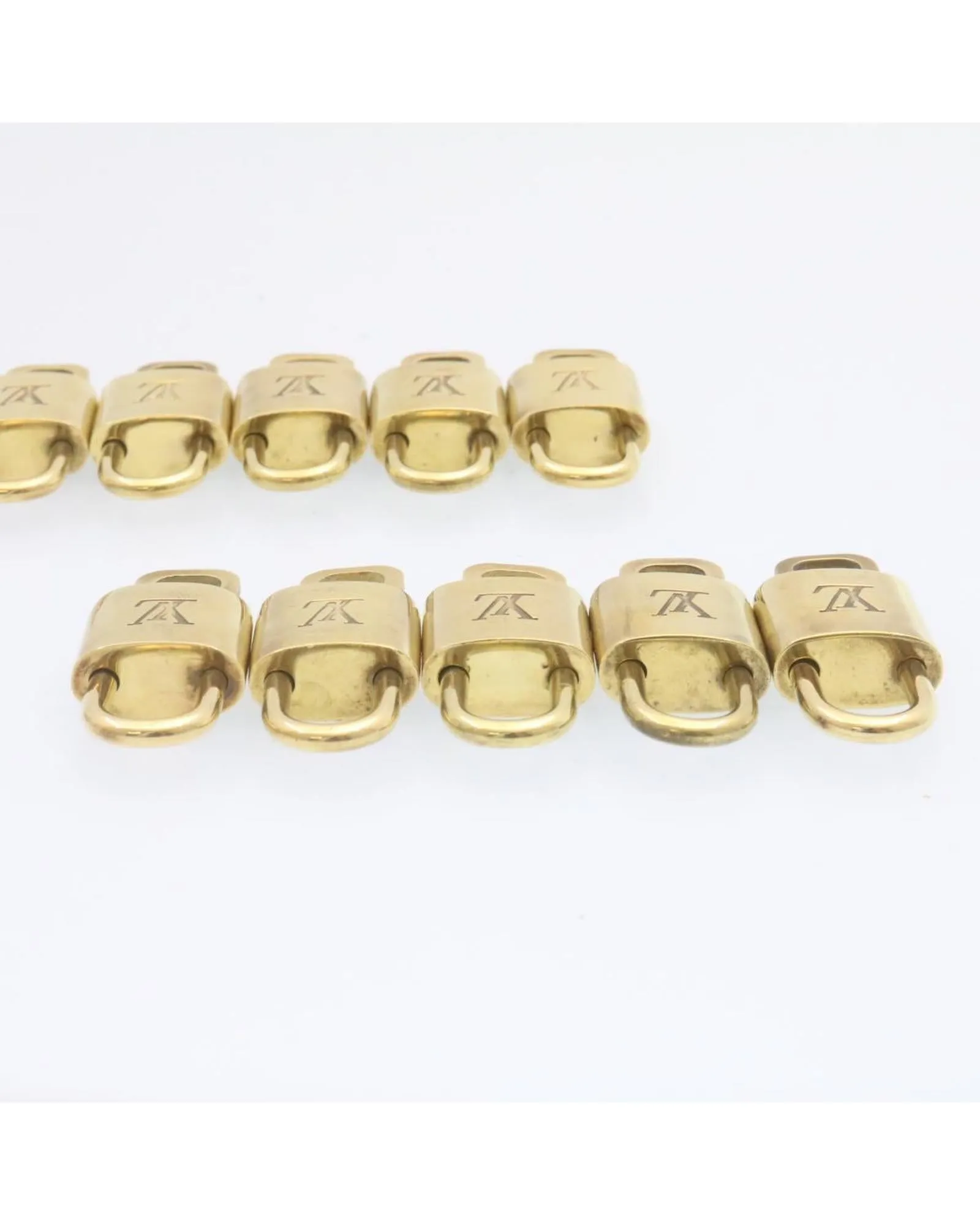 Authentic LOUIS VUITTON Gold Tone Padlock - Set of 10