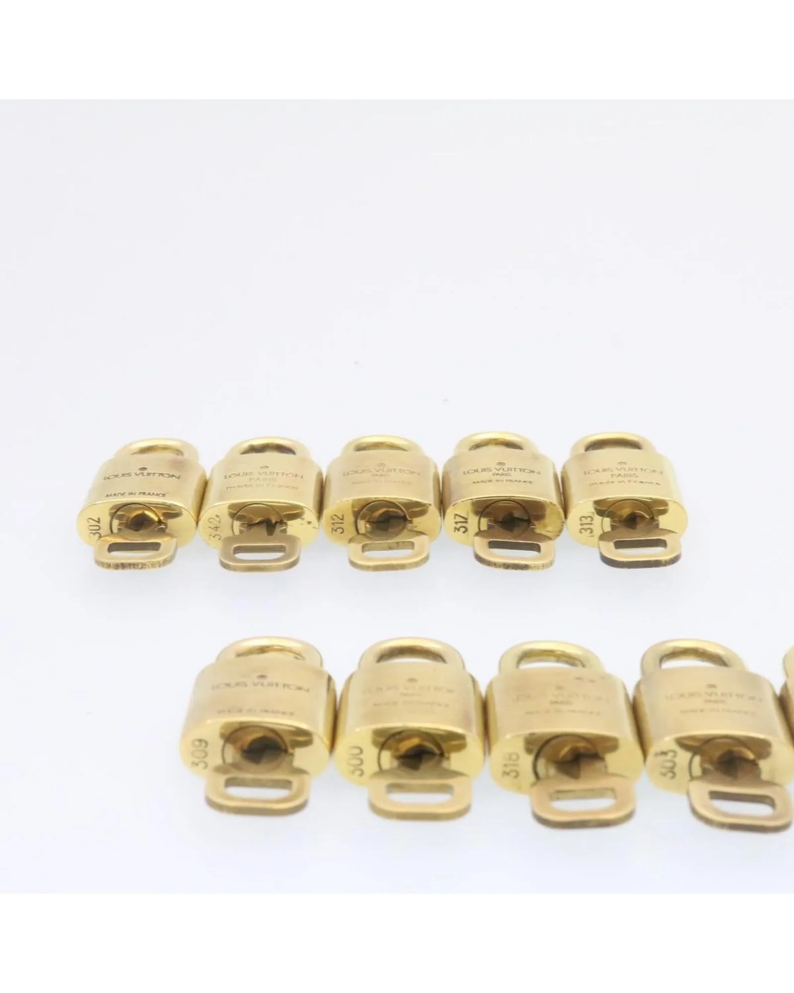 Authentic LOUIS VUITTON Gold Tone Padlock - Set of 10