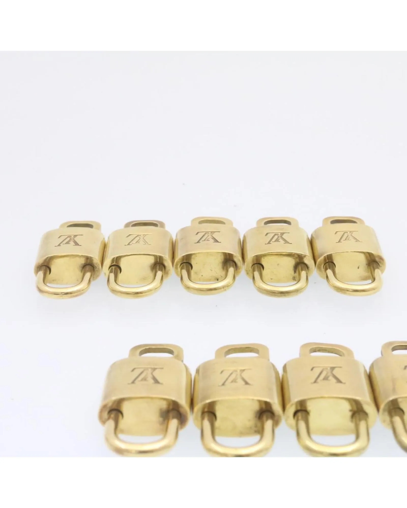 Authentic LOUIS VUITTON Gold Tone Padlock - Set of 10