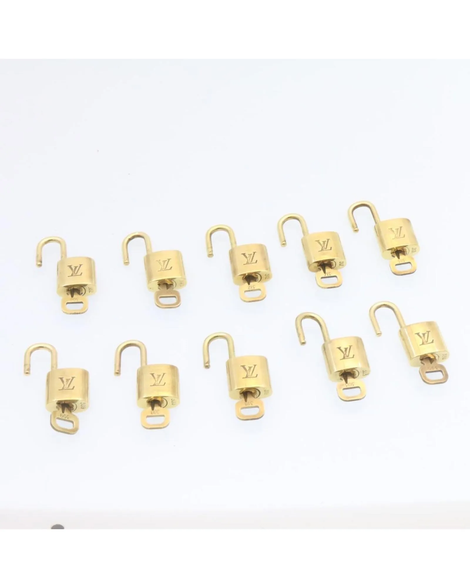 Authentic LOUIS VUITTON Gold Tone Padlock - Set of 10