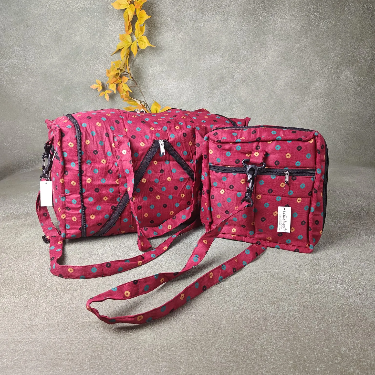 Expandable Travel Bag Maroon Colour with Small Green Black and Gold Dots Design.